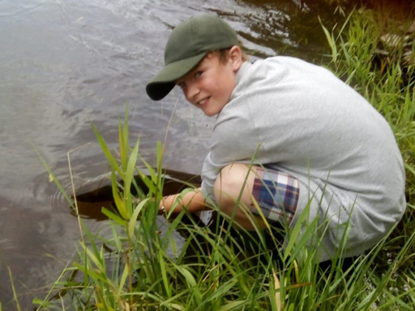 Brian Skinner's grandson returning a 12lb fish they caught on Gromain on the 8th